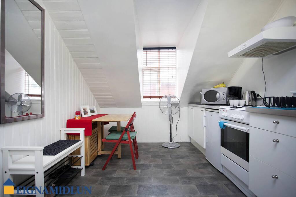 The kitchen. Chairs and table foldable and next to the left side wall