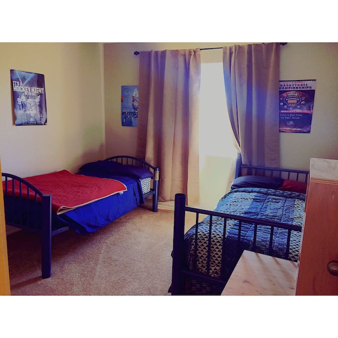 Bunk bed split with one on either side of the room for your comfort. TV in room included. Custom made closet to include cubbies, 2 levels of hanging space, and a laundry box.