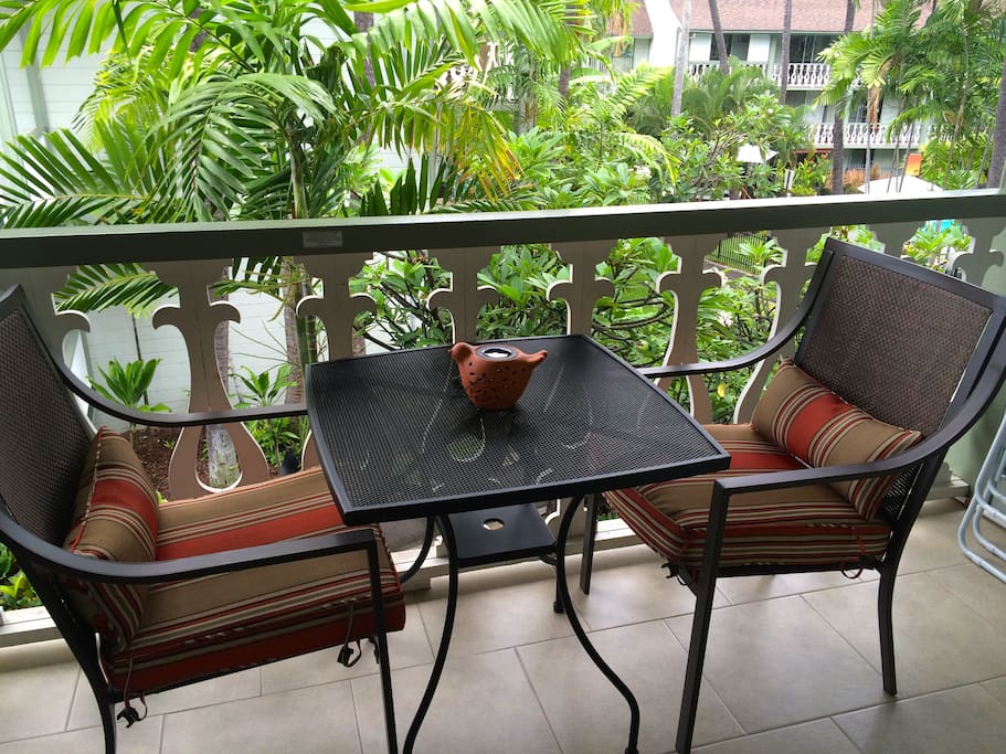 Lanai dining overlooking tropical gardens