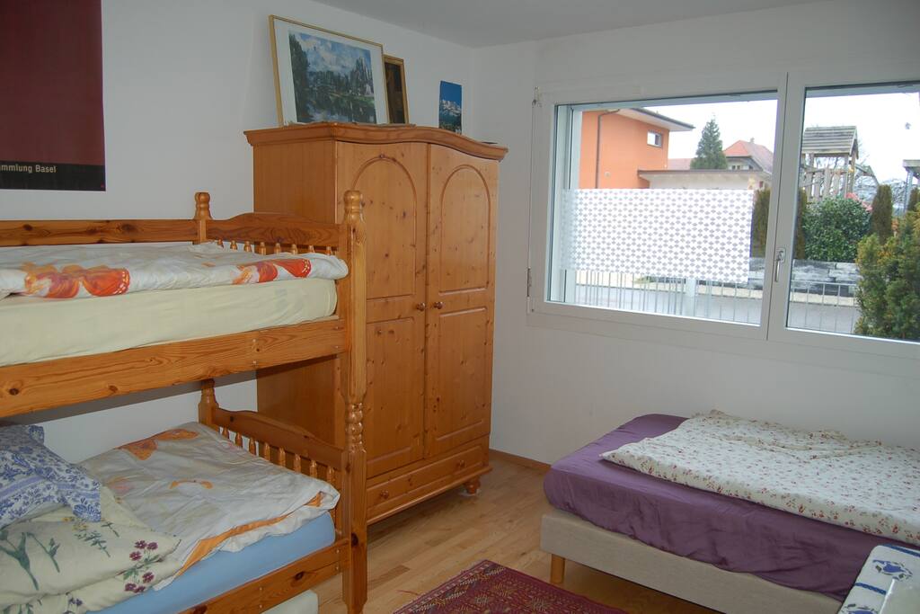 One of two rooms: one with single beds