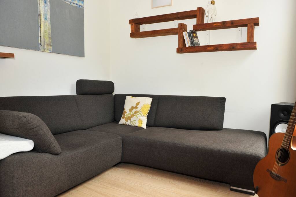 Lovely living room with diner table and just around the corner great couch