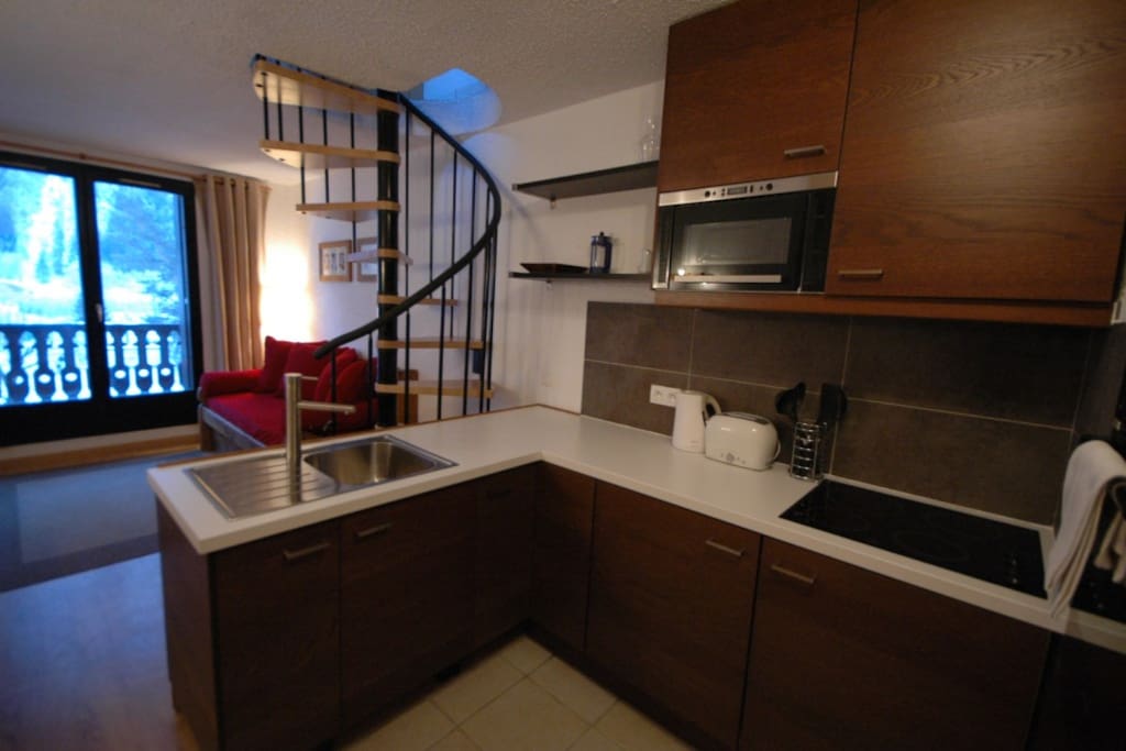Spacious kitchen & stairs to bedroom