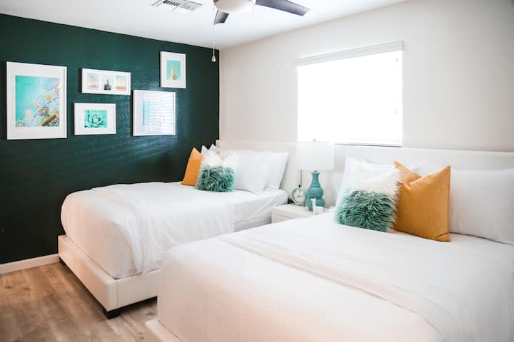 Beautiful bedroom #3:
Deep teal accent walls in this super cute, cozy room with 2 full beds