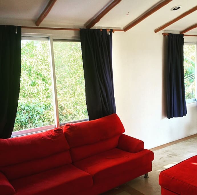 Illuminated living room, straight access to the terrace, comfortable couches and A/C right in front of it!