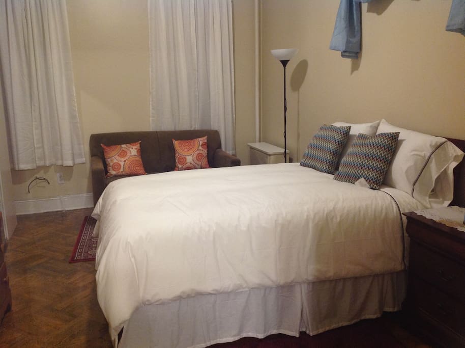 bedroom showing bed and loveseat