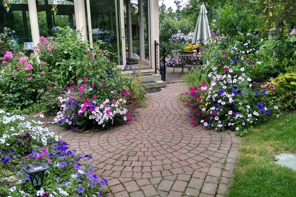 Walkway to patio with beautiful gardens