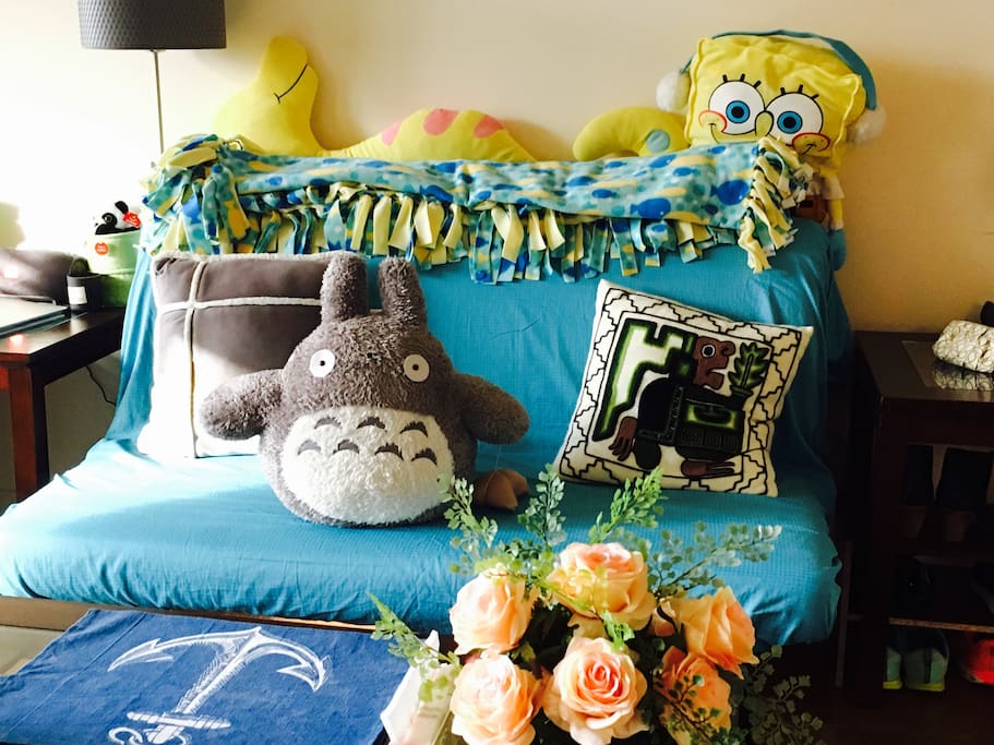 Cozy couch with the company of Spongebob and Totoro