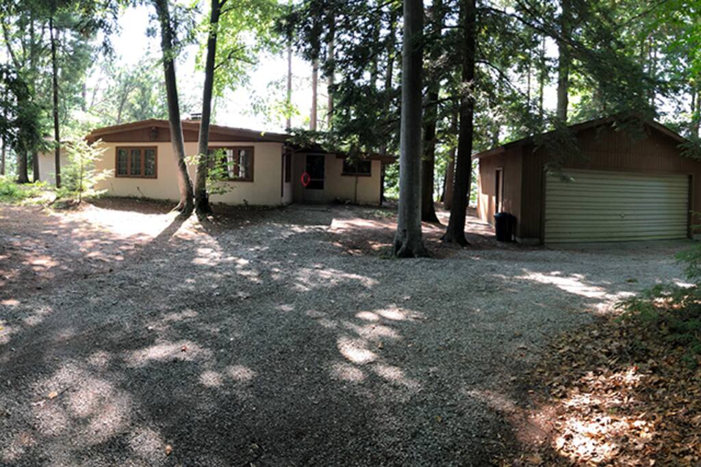 Back of cottage facing half acre woods and private access road