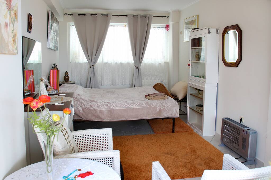 Queen sized bed in a spacious bedroom
