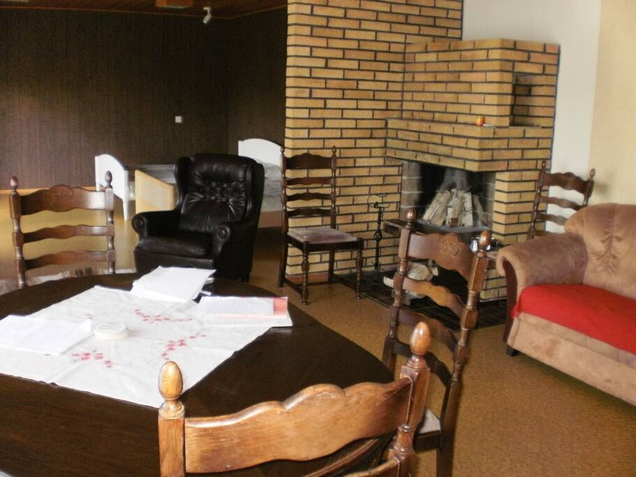 60m2 living room where is fireplace and 2 beds for 3 person sleeping