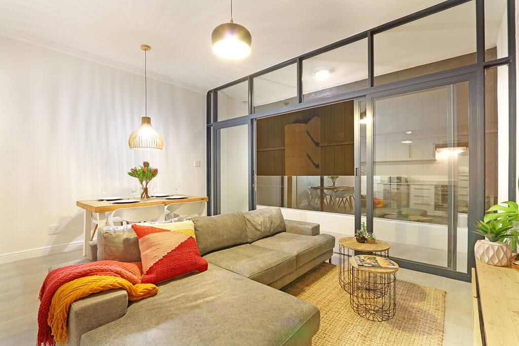 Comfy sofa and a balcony with a Lion's Head and a city view