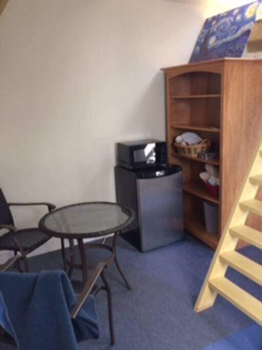 Eating area with mini-fridge and microwave.