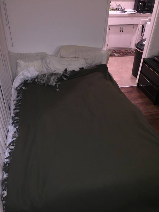 Full Sized Bed right when you walk in to the left.