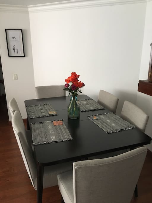 Dining area. The table is extendable, with 4, 6 and 8 place settings.