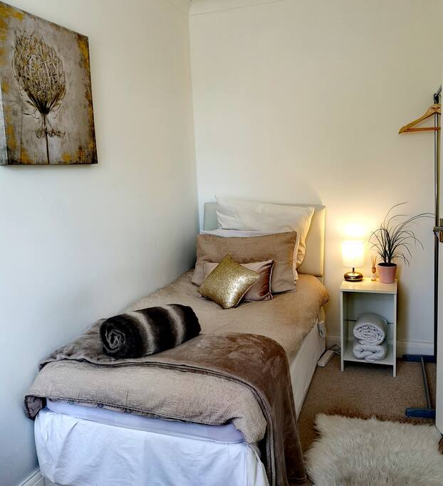 Comfy bed with electric blanket. Towels provided. Hanging rail available