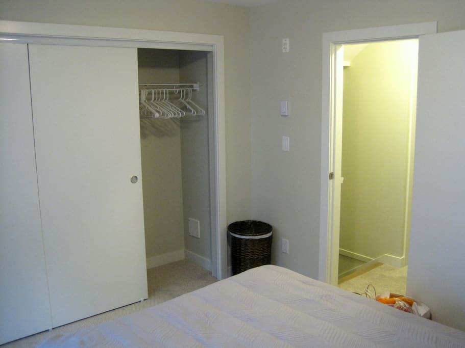 Large closet with hangers extends the entire wall