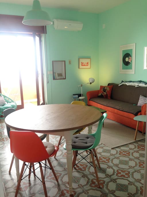 The living room with access to the balcony