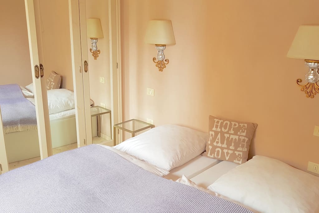 Comfy bed with wardrobe and mirror