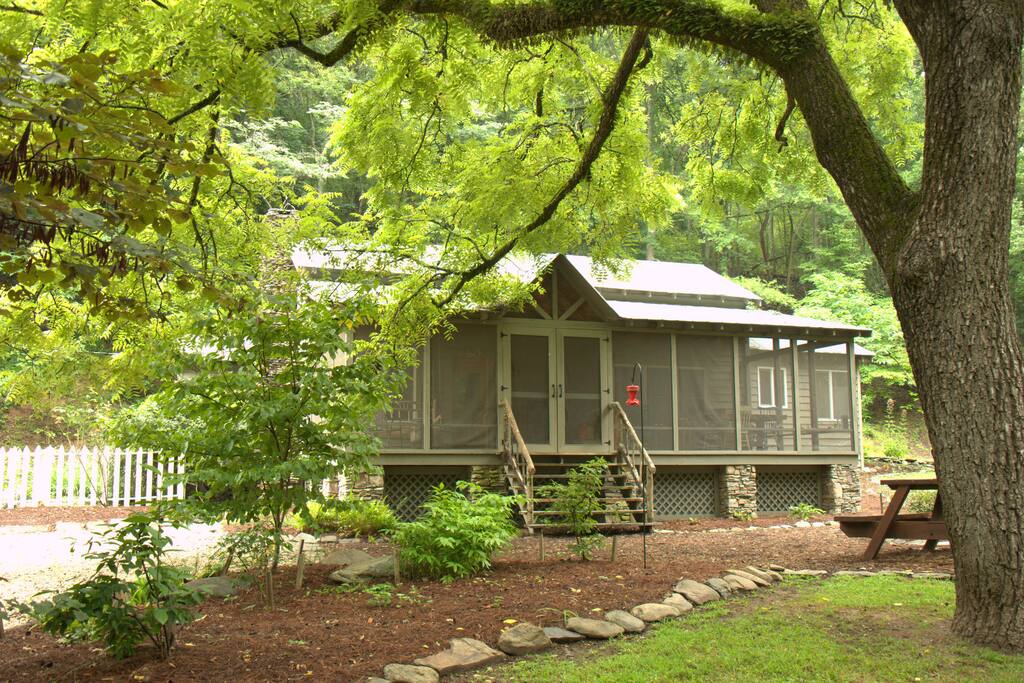 The Wildacre cabin has wildflower beds in front of the cabin.