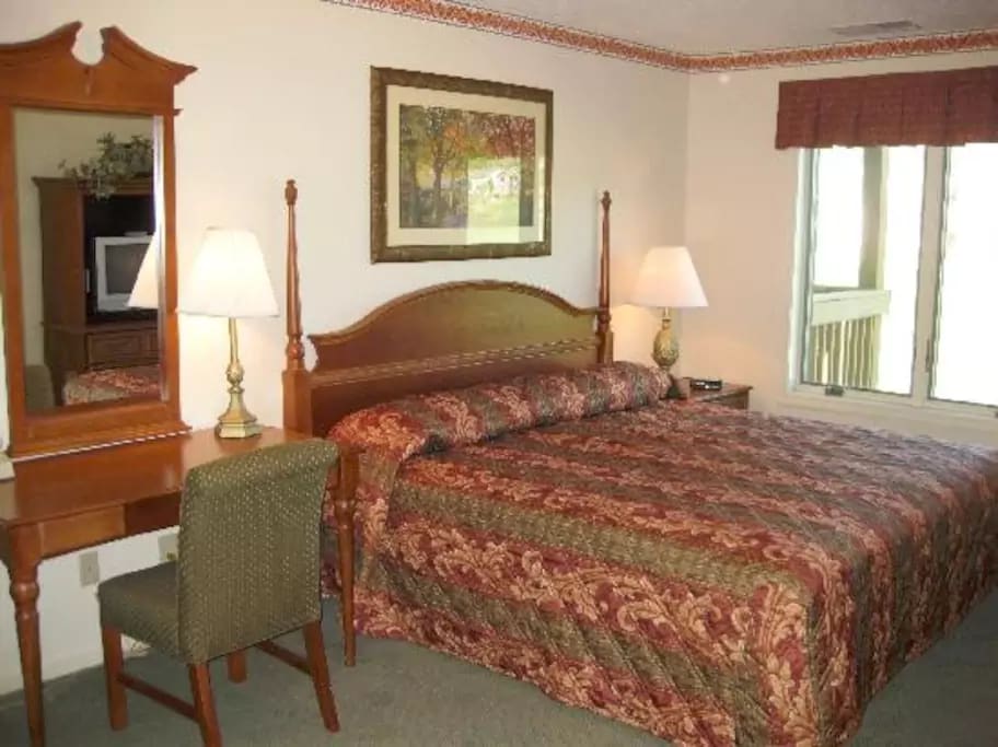 Master bedroom with king size bed.