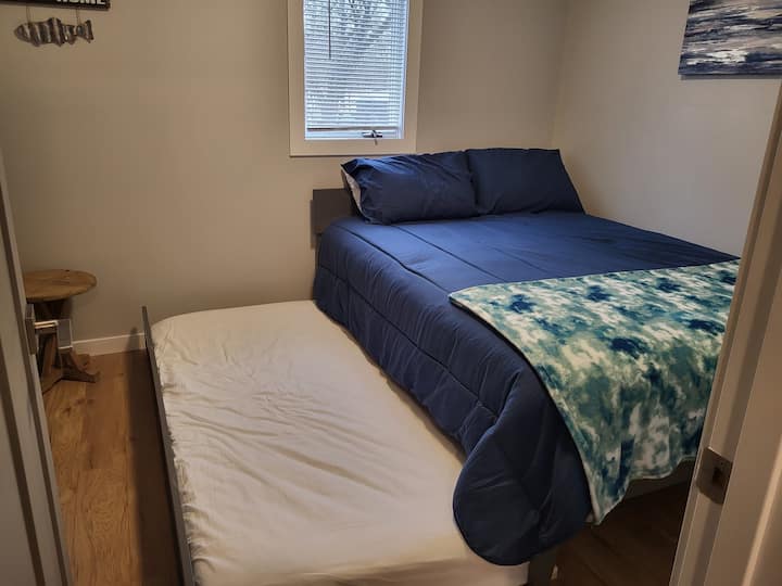 Cama tamaño queen con cama nido