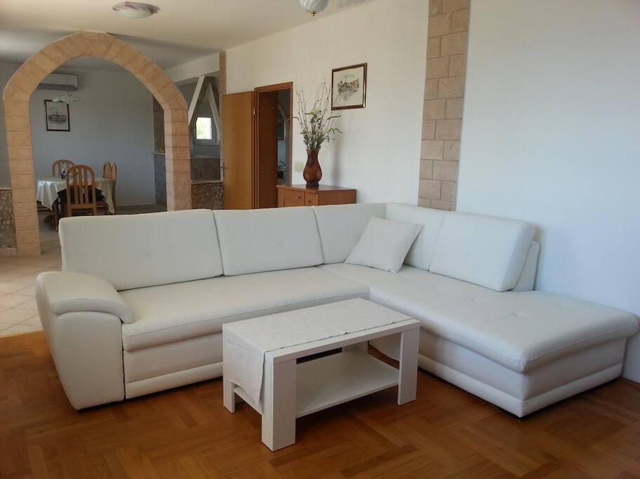 living room with sofa which can be also extra bed