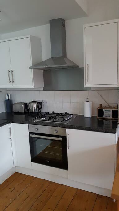 Kitchen with gas hob and electric oven