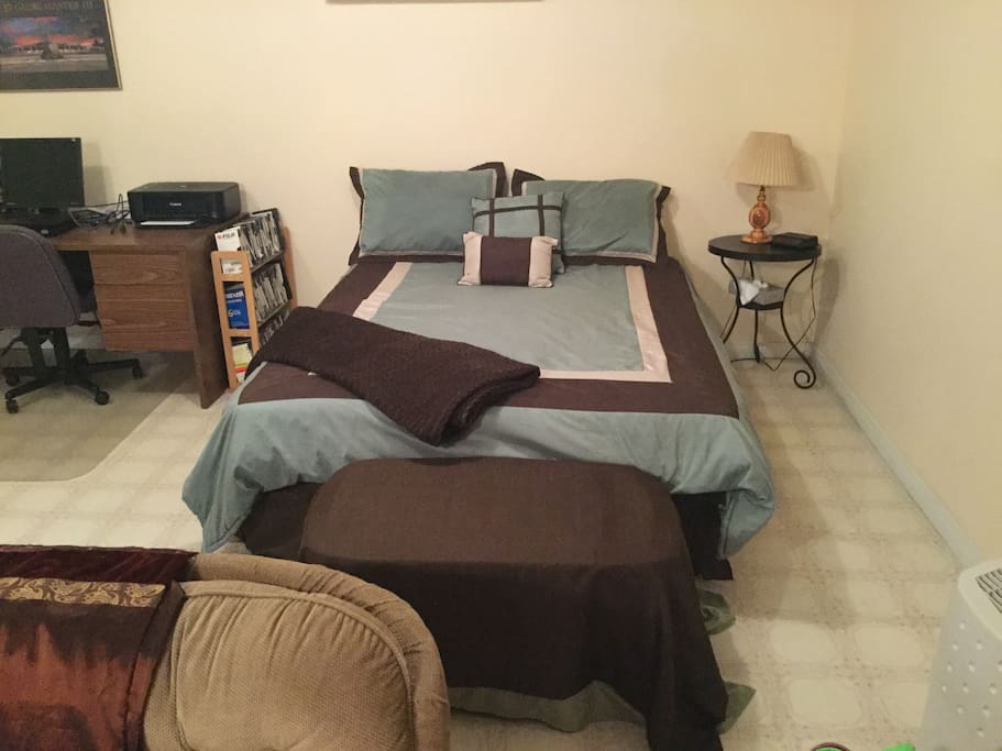 Queen bed in common room