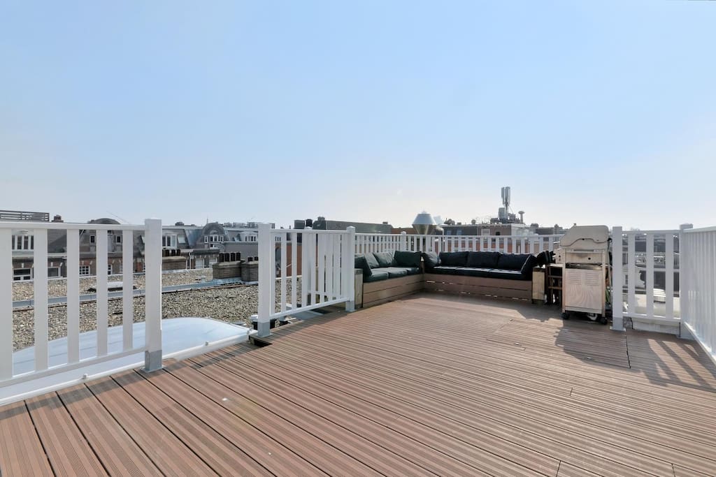 The large rooftop terrace boasts a comfy lounge area