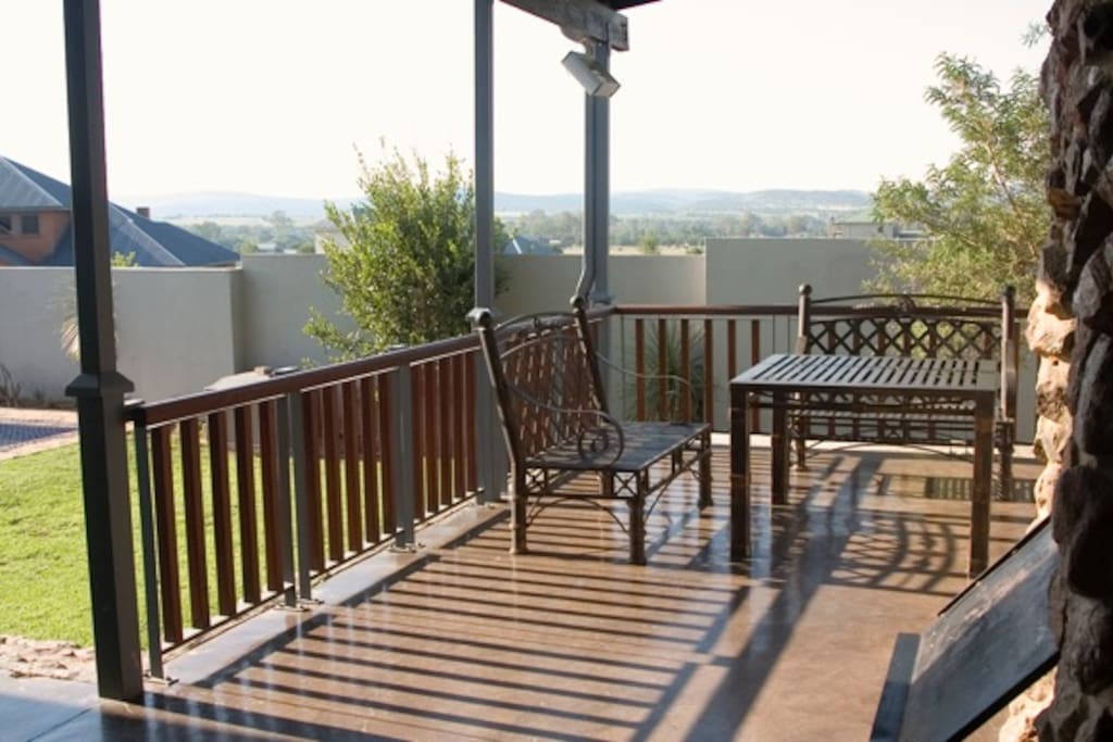Lovely stoep with outdoor braai overlooking the pool.