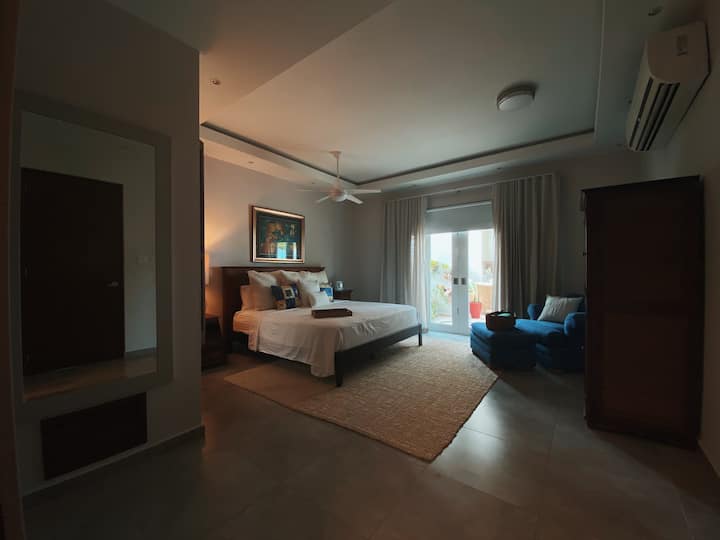 Master bedroom with en-suite bathroom including whirlpool spa tub, walking closet and a private doorway to the pool.

