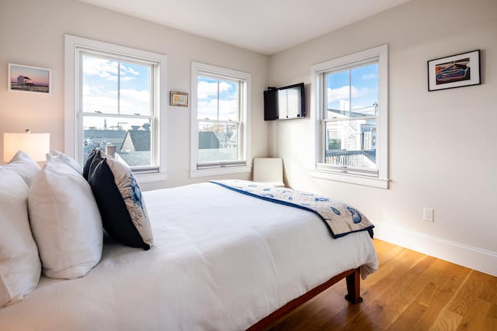 Bedroom with Queen size bed, two nightstands, bluetooth & wireless phone charger w/radio, HDTV, and top down bottom up black out shades for the utmost privacy!