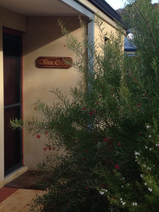 Exterior view of cottage and native Western Australia flora