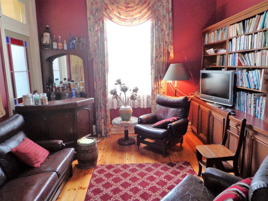 A cosy library has radio, TV and a bar fridge. Wi Fi is available in the library.