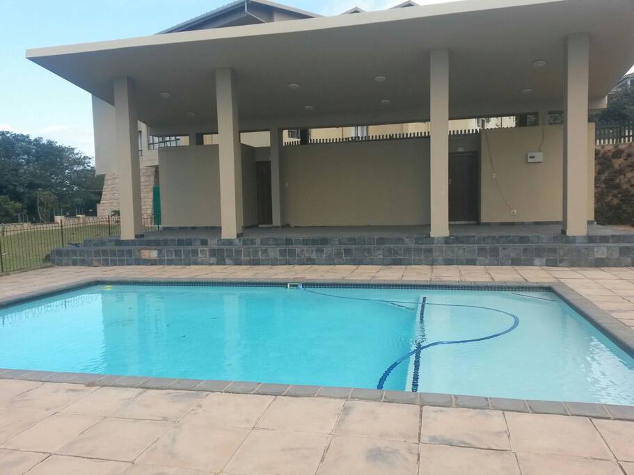 Serene swimming pool with change rooms and toilets in the complex.