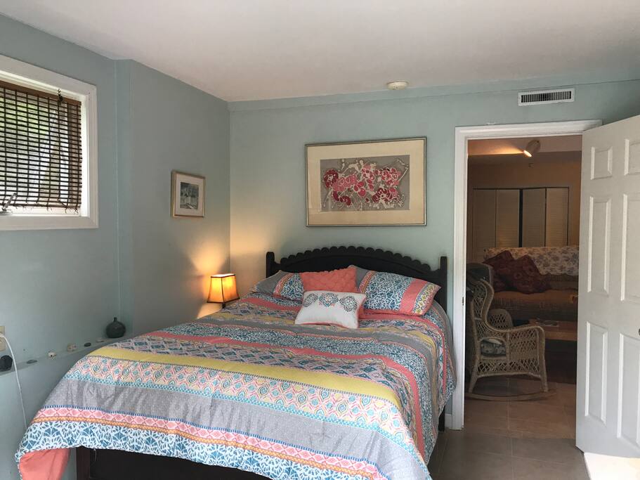 Comfortable bed, open and airy space with private entry way