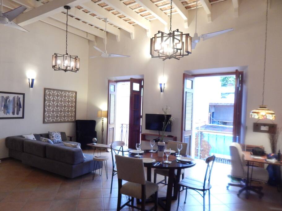 Two double doors open to the balcony