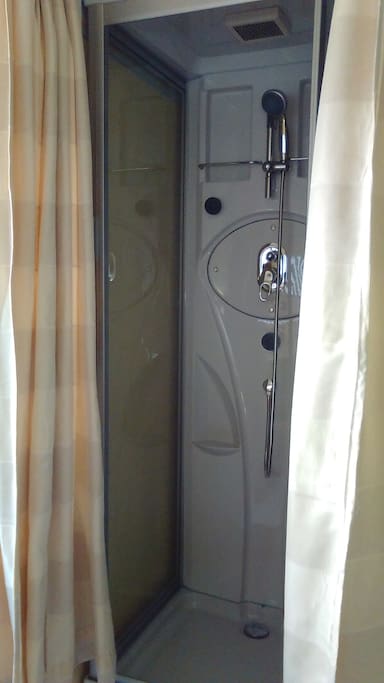 Shower booth in the same room as dinning table installed