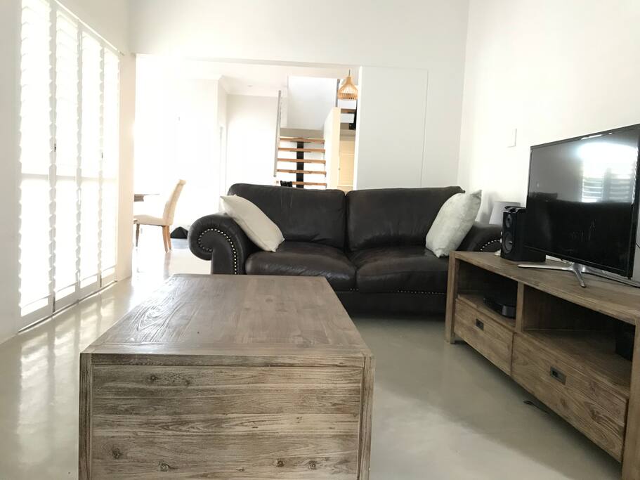 Living room with 2 leather couches