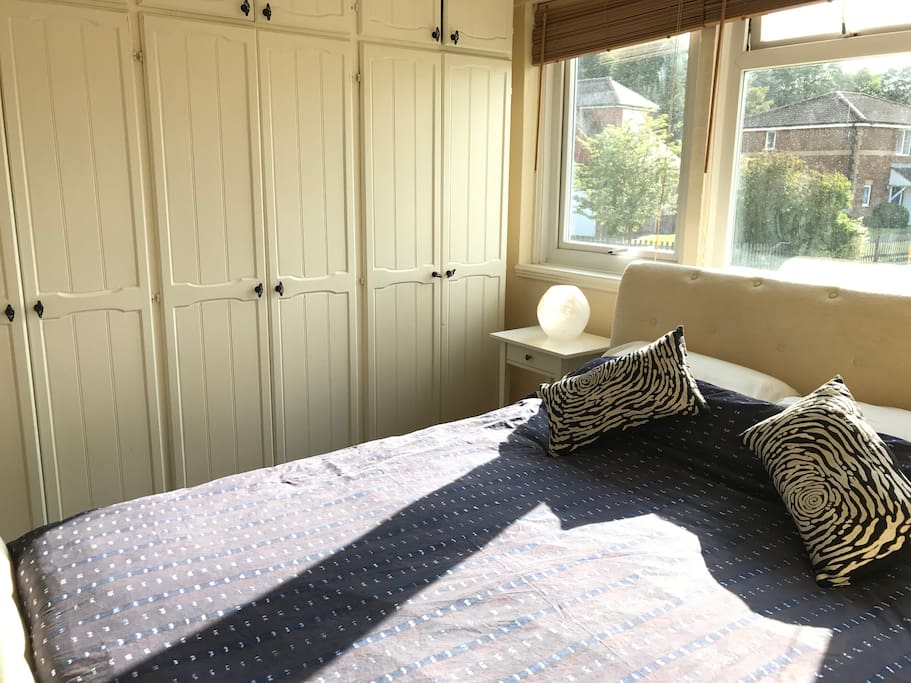 Master bedroom with one Queen sized double bed and wardrobes