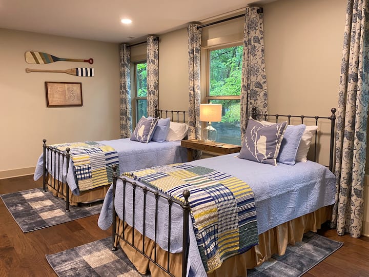 Upstairs loft sleeping area with two twin beds, each with trundle beds, allowing for 4 twin beds in this area. This area is open to the living room below. 