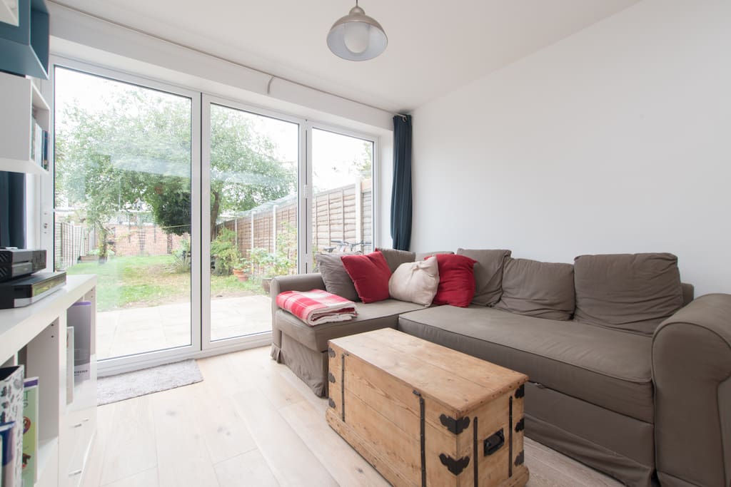 Living room area - tri fold doors open onto the garden