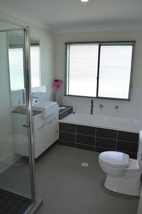 Modern bathroom with bath tub and separate shower.