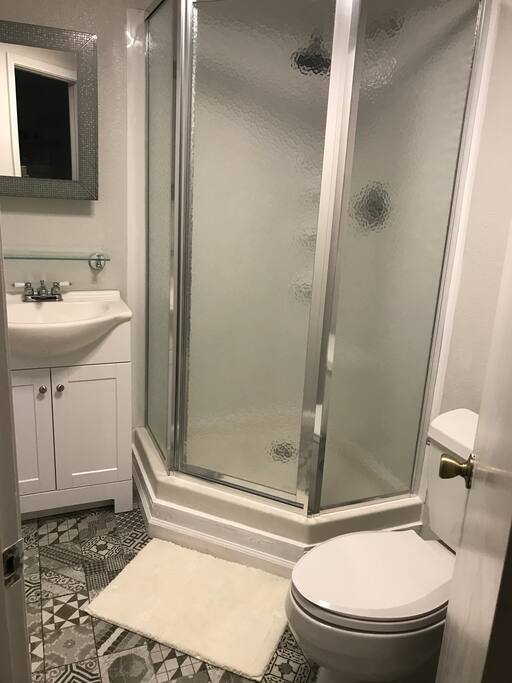 Beautifully renovated shower and bathroom with Spanish tiles.