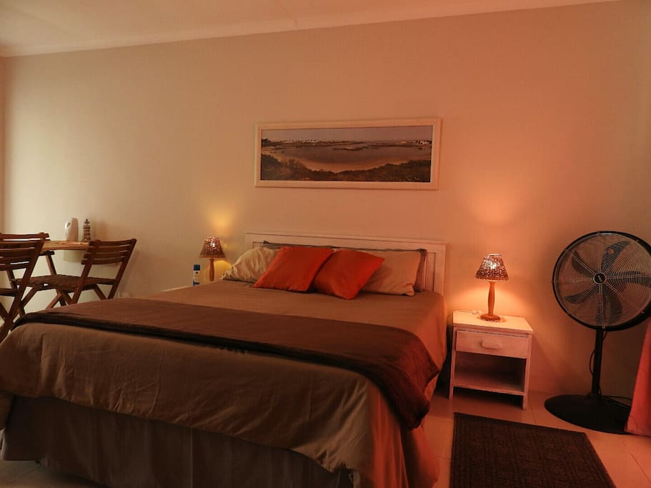 Double bed in open plan sleep and lounge area.