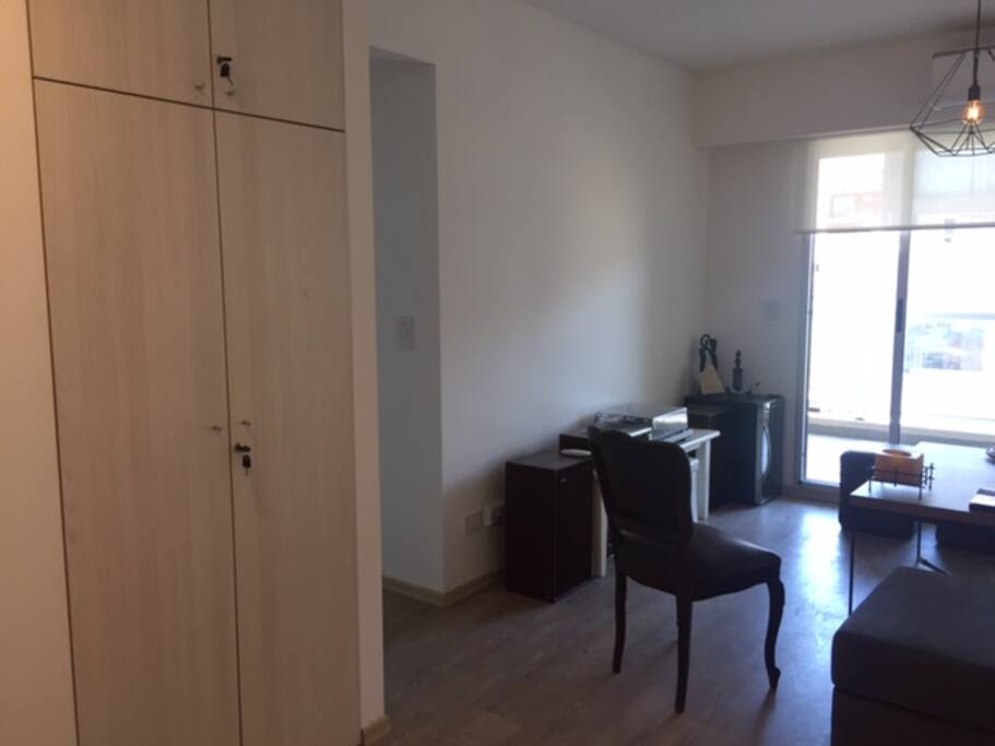 Reception closet and living room view.