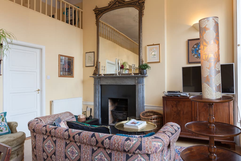 Grey marble 'Regency' period fireplace with gilt and black mirror