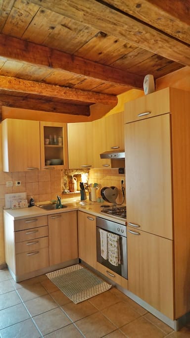 A full kitchen is ready to be used and is fully equipped.