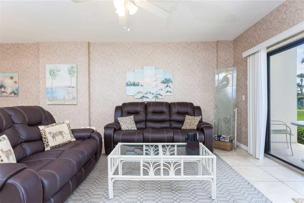 Spacious Living Room - Large comfortable couches and ceiling fan so you can enjoy your evenings with family and lots of breathing