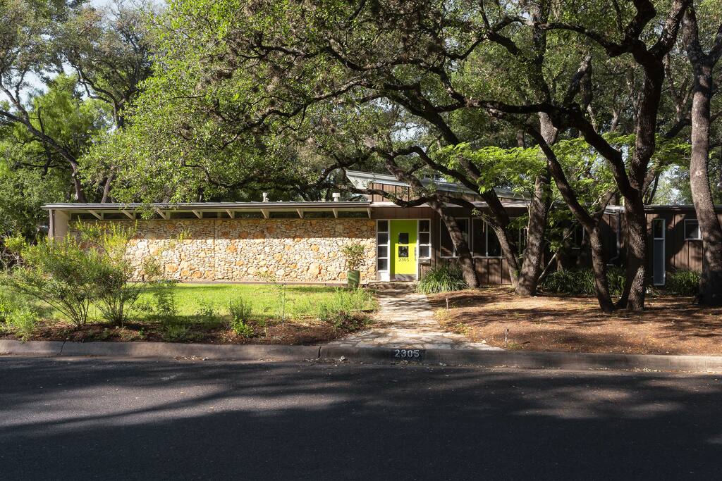 Exterior Entry under grove of live oaks